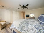Master Bedroom with TV and Private Bathroom at 630 Queens Grant